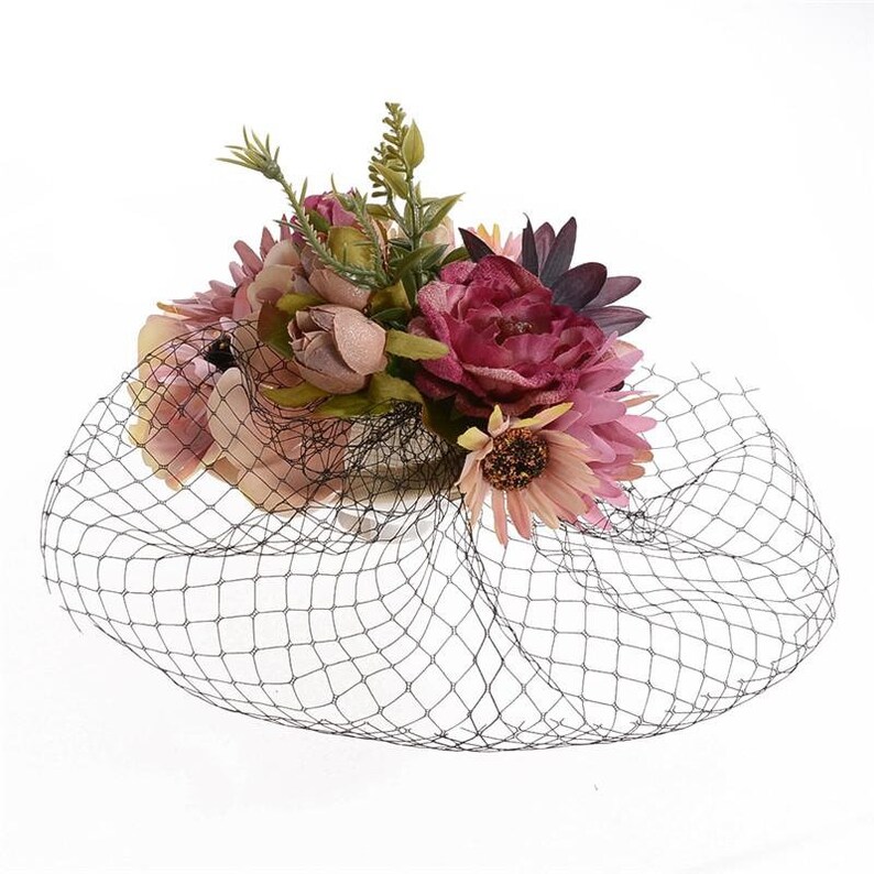 Wedding Guest Races Pink flower fascinator with black cage veil