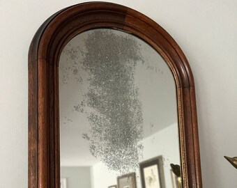 Dark wood arched mirror w/ antiqued glass
