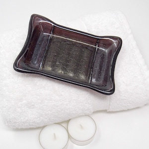 May include: A rustic wooden sign with the text "Welcome to our home" in white lettering. The sign features a distressed finish and a simple, inviting design, perfect for front door decor.