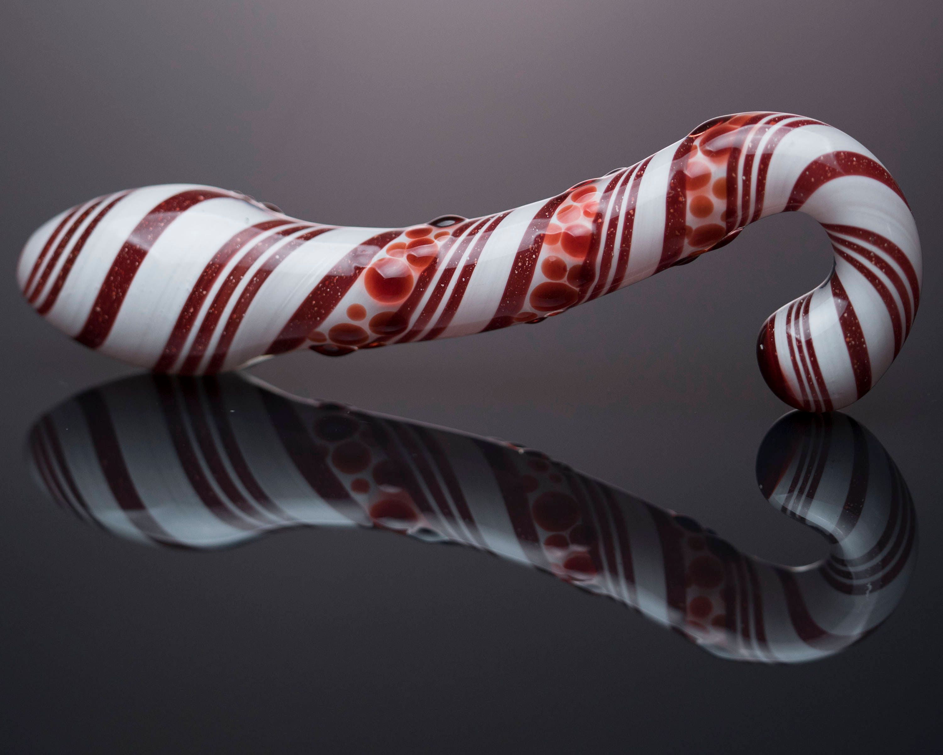 Glass candy cane dildo