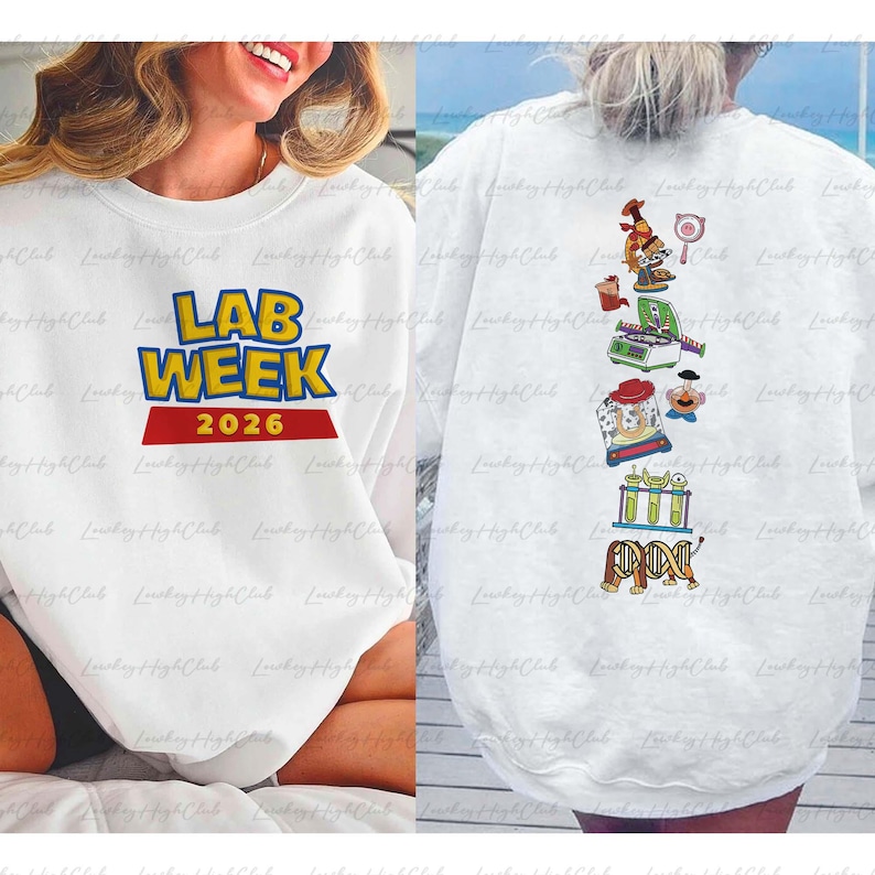 May include: White sweatshirt with the text "LAB WEEK 2026" in blue and yellow, with a red banner. The back of the sweatshirt features science-themed cartoon graphics, including a microscope and test tubes.
