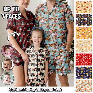 May include: Matching family pajama sets with custom photo, color, and text. The sets feature short-sleeved button-up shirts and shorts. One set has a red background with cat faces, another has a blue background with dog faces, and the third has a cream background with cat faces.