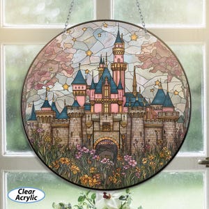 May include: Round stained glass art piece featuring a pink and blue castle with multiple turrets, set against a starry sky and surrounded by flowers. The words "Clear Acrylic" are printed on the bottom left.