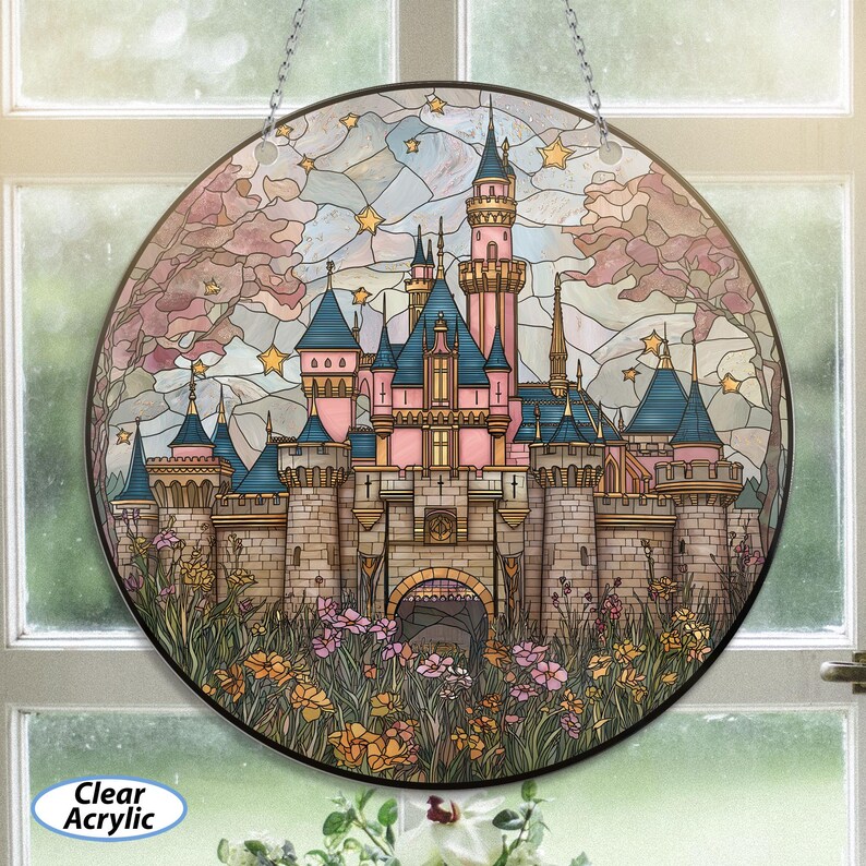 May include: Round stained glass art piece featuring a pink and blue castle with multiple turrets, set against a starry sky and surrounded by flowers. The words "Clear Acrylic" are printed on the bottom left.