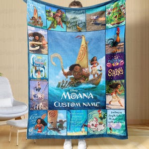 a man holding a blanket with a picture of moan on it