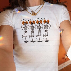 Coquette Skeleton Dance Baby Tee, Dancing Skellies Halloween Baby Tee, Vintage Spooky Vibes Fitted Tee, Funny Halloween Girl Outfit, MYJ006