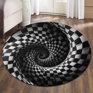 May include: A round rug with a black and white checkered pattern that spirals inward, creating a 3D optical illusion. The rug's design gives the impression of a vortex or a hole. The rug is placed on a wooden floor.