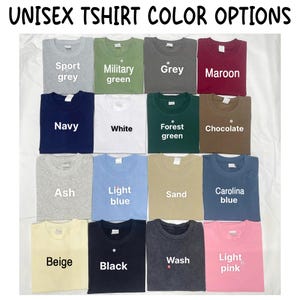 May include: A grid of sixteen folded t-shirts in various colours, labelled with text including Sport grey, Military green, Grey, Maroon, Navy, White, Forest green, Chocolate, Ash, Light blue, Sand, Carolina blue, Beige, Black, Wash, and Light pink.