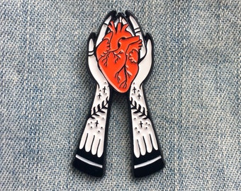 Tattooed Hands Holding Heart Enamel Pin: Spooky Witchy Lapel Pin