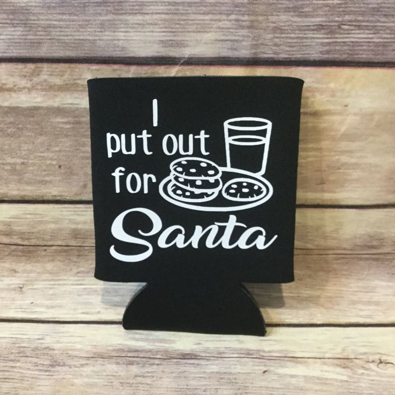 May include: Black and white can cooler with the text "I put out for Santa" and a graphic of cookies and a glass of milk.