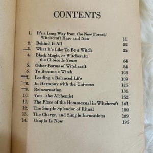 May include: Open book page featuring a table of contents titled "CONTENTS". The list includes chapter titles such as "Black Magic, or Witchcraft: the Choice Is Yours" and "The Simple Splendor of Ritual". The pages are aged with a cream color.