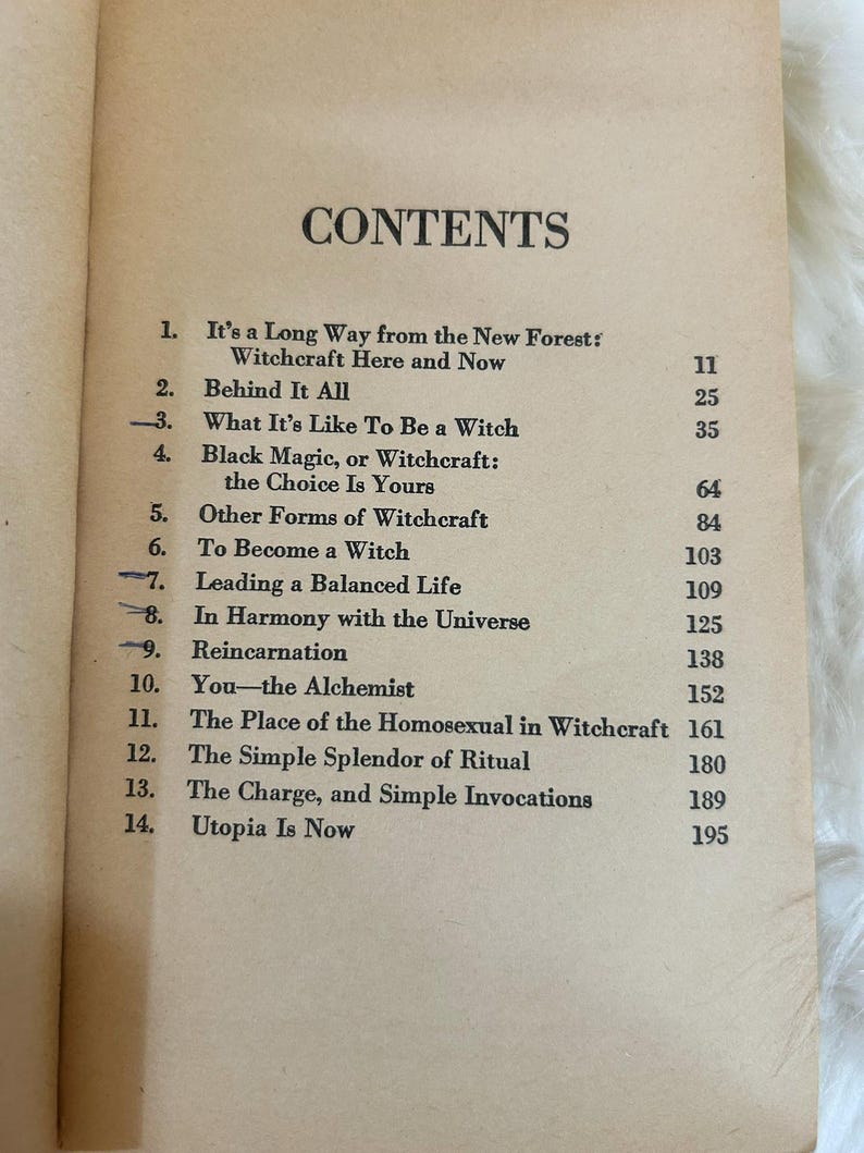 May include: Open book page featuring a table of contents titled "CONTENTS". The list includes chapter titles such as "Black Magic, or Witchcraft: the Choice Is Yours" and "The Simple Splendor of Ritual". The pages are aged with a cream color.