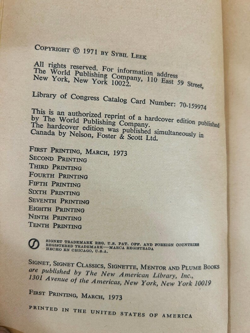 May include: A page from a vintage book with text including "COPYRIGHT &copy; 1971 BY SYBIL LEEK" and "FIRST PRINTING, MARCH, 1973". The text is printed in black ink on aged, off-white paper. The book is from The World Publishing Company.