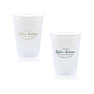 May include: Two white plastic cups with gold and green text. The text reads "GRADUATE Dylan Anderson SOUTHVILLE HIGH SCHOOL CLASS OF 2021".