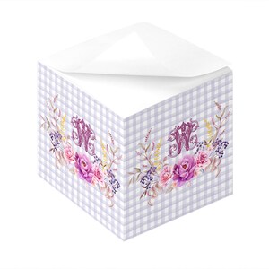 May include: A purple and white gingham notepad with a floral design and the letter "W" in a decorative font. The flowers are pink, purple, and white.