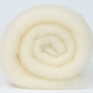 May include: A roll of white wool roving, a natural fiber used for felting and spinning.