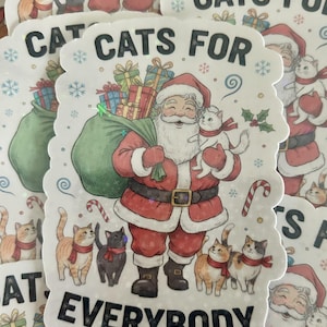 May include: A die-cut sticker featuring Santa Claus holding a white cat, carrying a green sack of gifts, and surrounded by four cats wearing red scarves. The text reads CATS FOR EVERYBODY, accented with snowflakes, candy canes, and holly.