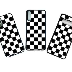 May include: Three black phone cases with a checkered pattern in black and white.