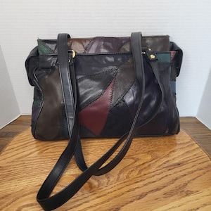 May include: A set of three ceramic mugs with a speckled, matte finish. The mugs are in shades of cream, light gray, and dark gray. Each mug has a simple, minimalist design, perfect for coffee or tea.