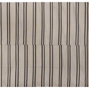 May include: A white and black striped rug with a simple, geometric design. The rug is made of a soft, woven material and has a subtle sheen.