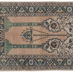 May include: A vintage prayer rug with a beige background and a central design featuring a chandelier with hanging lights. The rug has a blue, green, and black border with floral patterns.