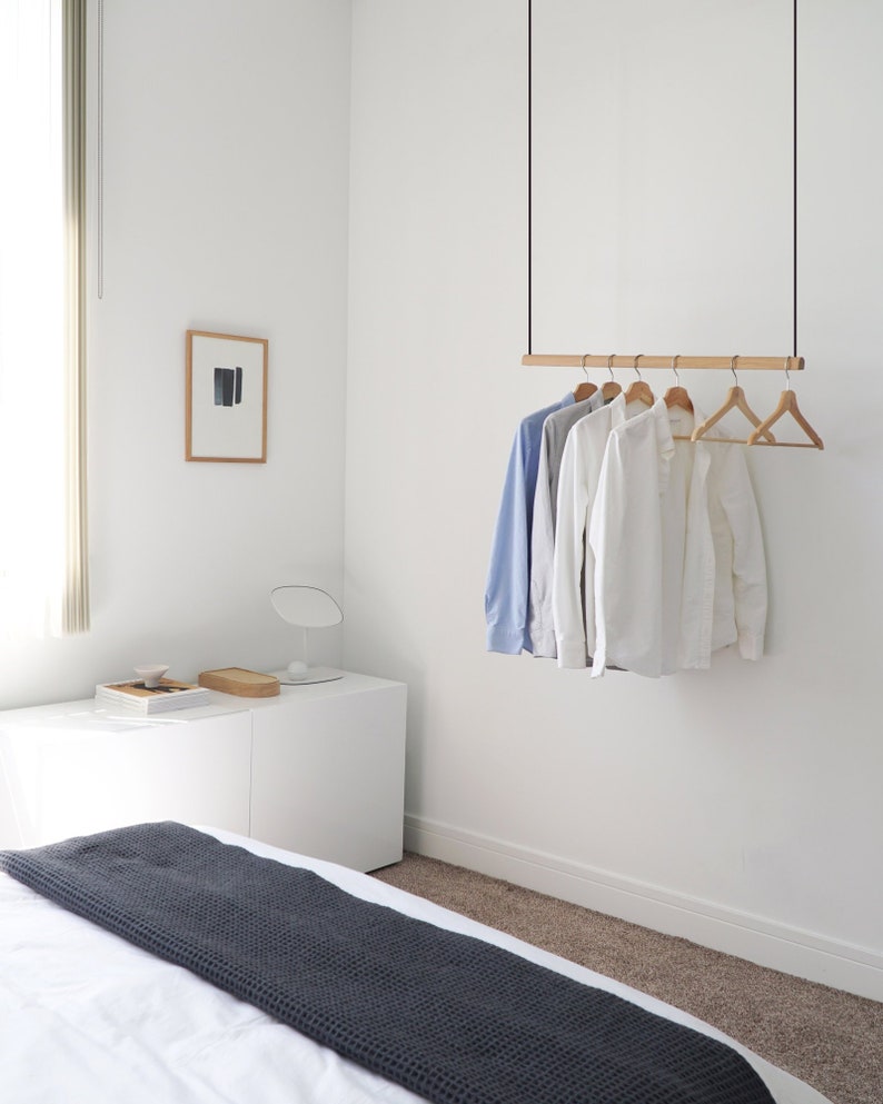 Hanging Clothes Rack  Ceiling Mounted Hanging Clothes Rack by Kroft Studio on Etsy. A few favorite Finalists for the Etsy Awards are spotlighted in this story with inspiring photos on Hello Lovely.