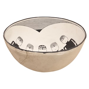 May include: A beige ceramic bowl with a black rim and a cracked exterior. The interior features a white background with a black geometric design and stylized figures. The figures have black bodies and patterned head coverings.
