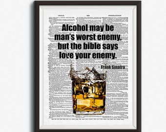 May include: A framed art print with the quote: "Alcohol may be man's worst enemy, but the bible says love your enemy." The image shows a whiskey glass with ice cubes, set against a vintage newspaper background.