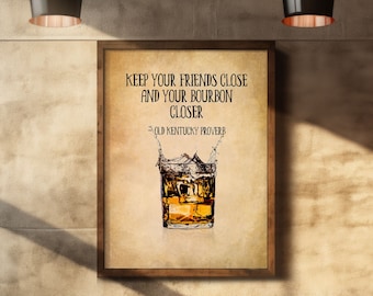 May include: A framed print with a vintage aesthetic featuring a glass of amber liquid with ice cubes and a splash of water. The text reads "Keep your friends close and your bourbon closer - Old Kentucky Proverb".