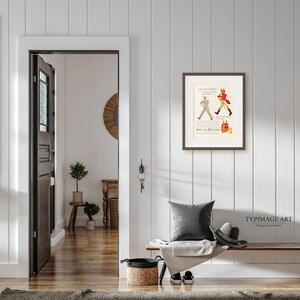 May include: A framed vintage advertisement for Johnnie Walker scotch whisky. The ad features a man in a red coat walking with a walking stick. The text reads "See the difference in the Scotch you buy" and "Johnnie Walker".