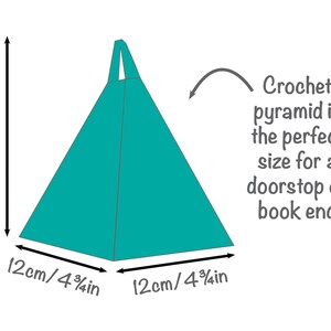 May include: A teal blue crochet pyramid, measuring 12 inches on each side, is a great size for a doorstop or bookend.  "Crochet pyramid is the perfect size for a doorstop or book end" is written in gray text.