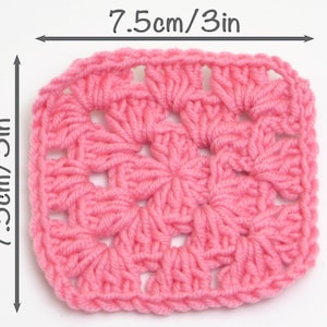 May include: A pink crochet square measuring 3 inches by 3 inches. The square is made with a repeating pattern of double crochet stitches.