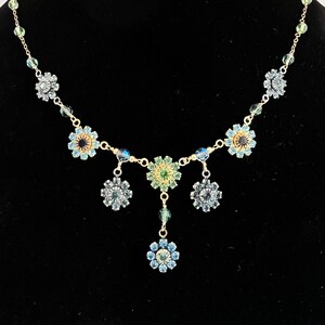 Whimsical and delicate heirloom necklace and earrings with vintage Swarovski flowers, gold filled adjustable chain and french wires