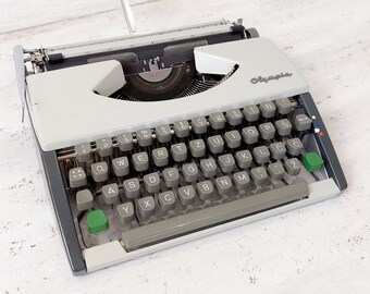 Olympia Aphamatic existe en  noir machine à écrire ruban noir/rouge