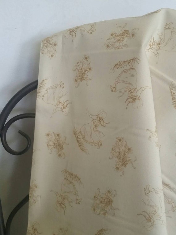 Andover Little House on the Prairie Line Art in Dark Gold of Little Girl Running Through Grass with Daisy Bouquet Motif on Ecru Background