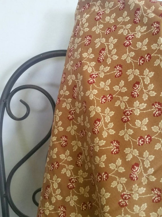 Andover Little House on the Prairie Burgandy and Ecru Roses With Ecru Leaves on Medium Tan Background Free Shipping By the Yard