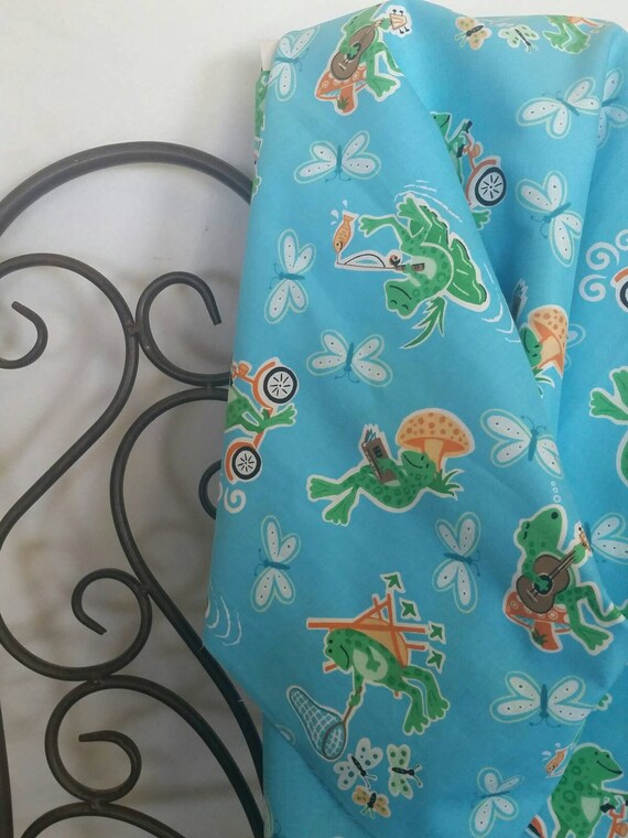 Fun Green Foggy Frogs 100 Percent Cotton on Blue Background Playing, Reading, Scootering, Crafting and Children's Fabric Free Shipping