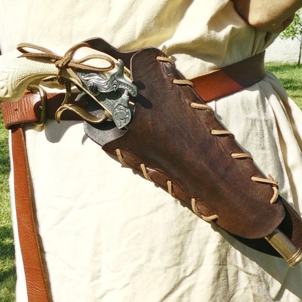 Flintlock pistol holster, in leather with laces and loops for the belt.