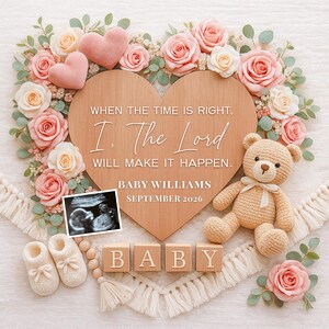 May include: A heart-shaped wooden sign with text, surrounded by pink and cream roses, eucalyptus, and two pink hearts. A crocheted teddy bear, baby booties, and wooden blocks spelling "BABY" are also present. The sign reads "WHEN THE TIME IS RIGHT, I, The Lord WILL MAKE IT HAPPEN. BABY WILLIAMS SEPTEMBER 2026."