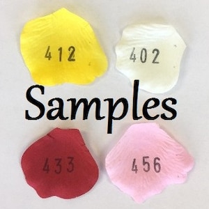 May include: Four samples of rose petals in different colors: yellow, white, red, and pink. Each petal has a number printed on it: 412, 402, 433, and 456.