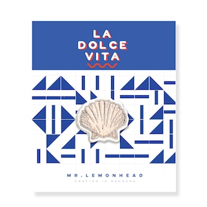 May include: White seashell embroidered patch with a blue and white geometric pattern background. The text "LA DOLCE VITA" is in red and blue on a blue background. The text "MR. LEMONHEAD" and "CRAFTED IN BANGKOK" is in black on a white background.