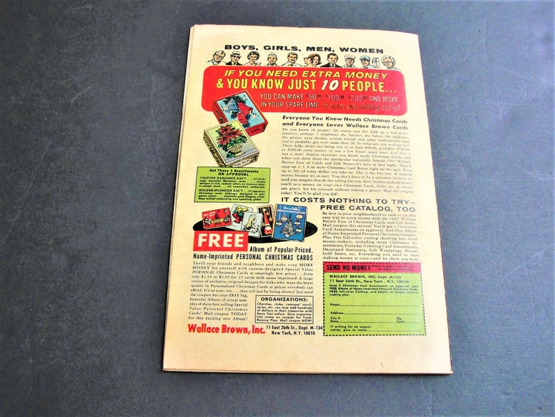 May include: A vintage advertisement for Wallace Brown, Inc. Christmas cards. The ad features a colorful illustration of a Christmas card with a red poinsettia and the text "Everyone You Know Needs Christmas Cards and Everyone Loves Wallace Brown Cards". The ad also includes a call to action to send for a free catalog.