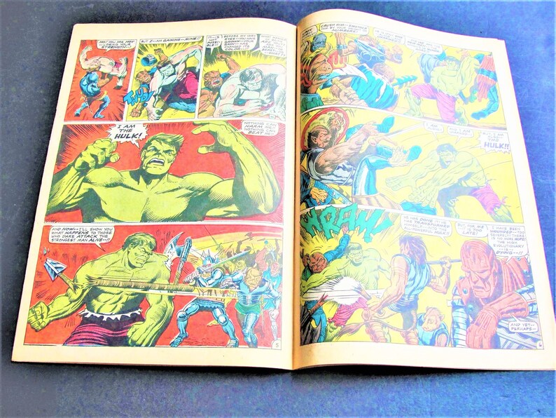 May include: A comic book page featuring the Hulk in a green and purple costume. The Hulk is shown in various poses, including punching, leaping, and roaring. The text on the page reads "I am the Hulk!" and "Hulk!"