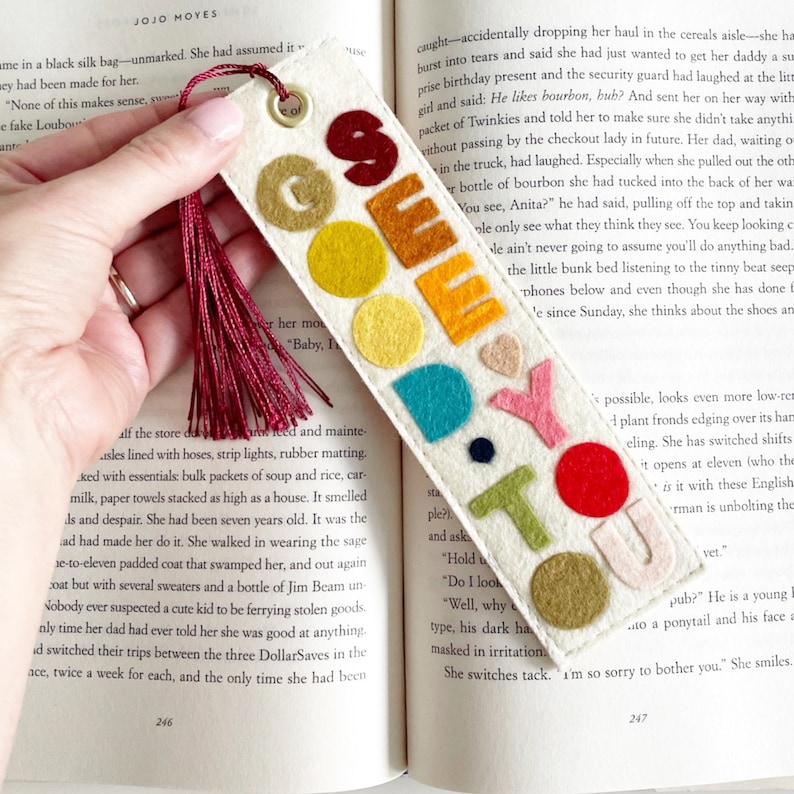 May include: A felt bookmark with the words "Go Do You" in colorful felt letters. The bookmark has a red tassel.
