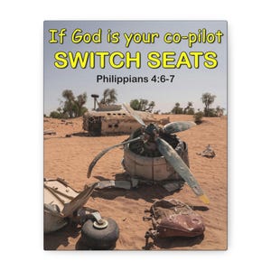 May include: A rectangular wall art print featuring a desert landscape with a crashed airplane wreckage. The text reads: If God is your co-pilot SWITCH SEATS Philippians 4:6-7. The scene shows a propeller engine, landing gear, and fuselage.