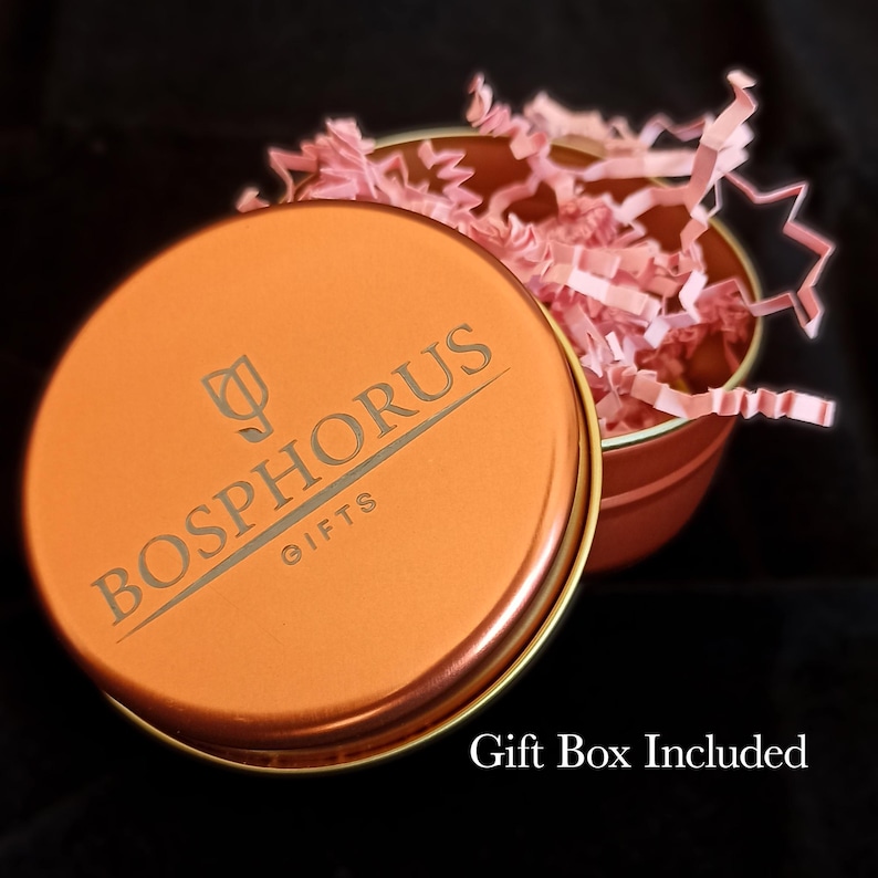 Orange branded elegant tin gift box with Bosphorus Gifts logo, filled with shredded paper packaging