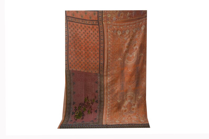 May include: A patchwork quilt with a variety of floral and geometric patterns in shades of orange, brown, and pink.