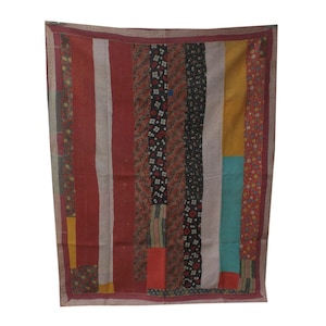 May include: A vintage kantha quilt with a patchwork design. The quilt is made of different fabrics in shades of red, black, yellow, and blue. The quilt has a border of a darker red fabric.