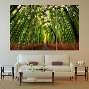 May include: A three-panel canvas print depicting a path through a lush green bamboo forest. The path is lined with tall bamboo stalks, and the sunlight filters through the leaves, creating a dappled effect.
