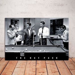 May include: Black and white photo of four men playing pool. The men are all wearing suits and ties. The photo is captioned "The Rat Pack".